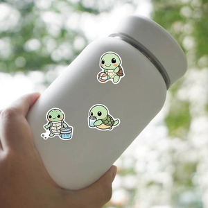 Waterproof PVC turtle stickers applied on a frosted water bottle with natural background