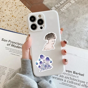 Detail of white iPhone case featuring cartoon mushroom ghost prints and skin-like texture