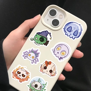 Close-up of colorful groovy skull decorative stickers on a modern smartphone case