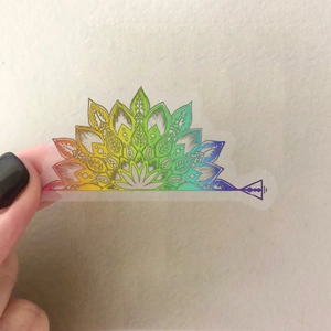 Close-up of rainbow mandala sticker with vibrant floral patterns and golden finish
