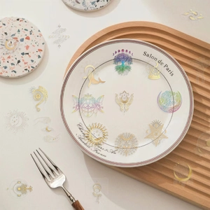 Macro view of gold celestial planet stickers with sun and moon designs on PET paper