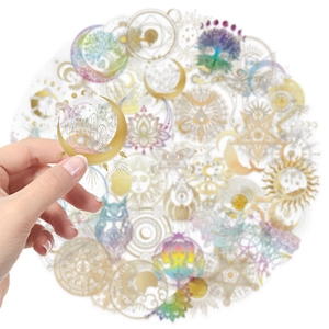 Close-up of waterproof transparent PET stickers with gold foil mystical moon and sun patterns