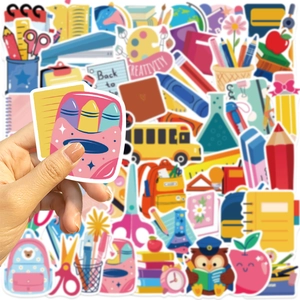 Close-up of waterproof cartoon back to school stickers for laptops and guitars
