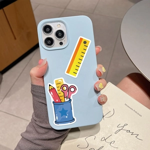 Detail of light blue iPhone case with cartoon stationery pattern in daily life setting