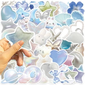 Close-up of holographic dream galaxy stickers showing pearl finish and star shapes