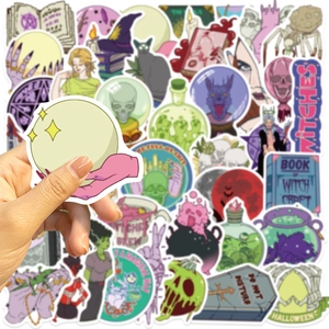 Close-up of hand holding a magic crystal ball sticker from the 50pcs witch doodle set