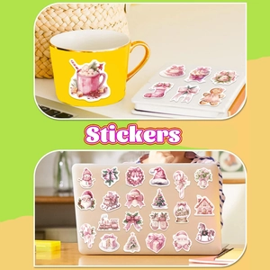 Set de stickers de Noël roses avec Père Noël et bonhomme de neige sur un ordinateur