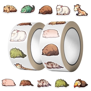 Macro view of cartoon sleeping animal stickers in rolls for scrapbooking decoration