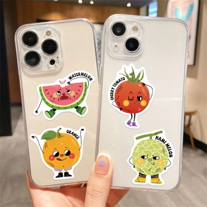 Cute cartoon fruit stickers on transparent iPhone cases featuring watermelon and cherry tomato