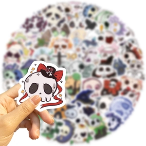 Detail shot of a cartoon skull sticker with red bow and black hat for Halloween