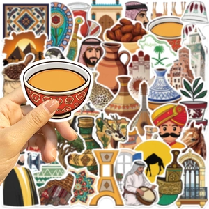 Close-up of Middle Eastern graffiti stickers with Arabic coffee cup and cultural icons