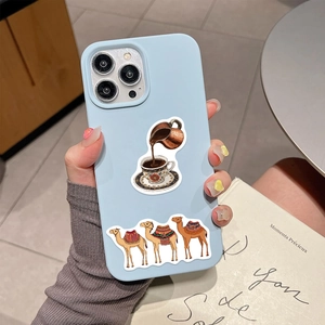Detail of light blue phone case with Mediterranean stickers showing camel and coffee pot