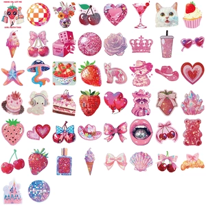 Close-up of 50pcs pink aesthetic glitter stickers featuring cat and castle patterns