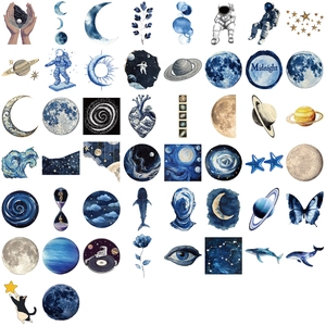 Flat lay of 42 waterproof blue laser space stickers with astronauts and whales on white