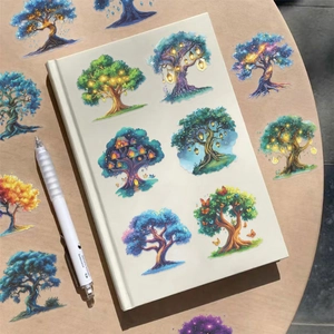 Detail of waterproof cartoon magic tree stickers on a notebook cover and wooden table surface