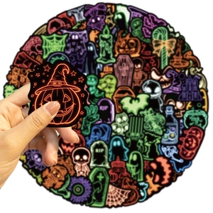 Close-up of waterproof neon Halloween stickers featuring pumpkin and ghost designs