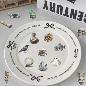 Macro detail of waterproof gothic watercolor stickers with crows and crystals for journals