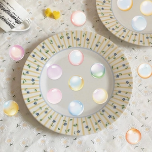 Macro detail of colorful pearlescent translucent bubbles on a decorative plate