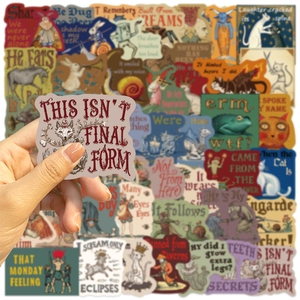 Close-up of surreal medieval graffiti stickers on hand for laptop and guitar decor