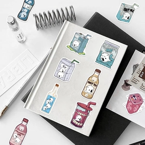 Detail shot of waterproof ghost food stickers on a laptop with creative drink designs