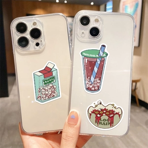 Detail showing creative monster food stickers on a clear iPhone case with tooth milk carton