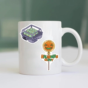 Waterproof Halloween stickers featuring mothman eggs and pumpkin candy on a white ceramic mug