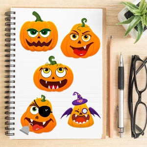 DIY Halloween pumpkin face stickers for crafts on a desk with creative office decor