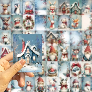 Close-up of a Christmas snowman sticker being held, showcasing festive winter illustrations