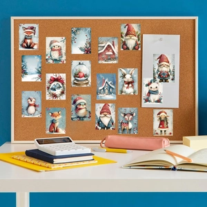 Cute winter snowman and animal stickers set displayed on a cork board workspace