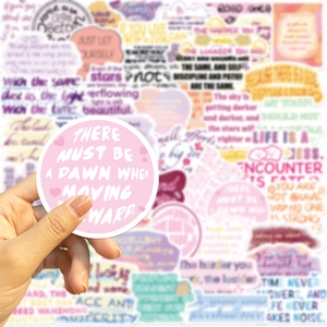Detail of round waterproof motivational stickers with pink inspirational quote graphics