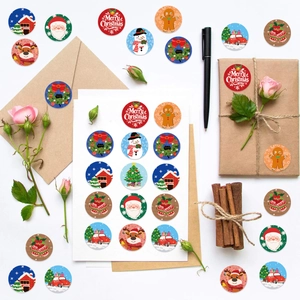 500pcs Christmas sticker roll featuring Santa, reindeer, and snowman for gift wrapping