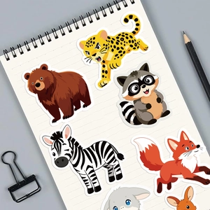 DIY cartoon animal stickers featuring leopard and rabbit on a minimalist notebook