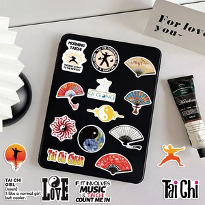 Macro view of cartoon Tai Chi graffiti stickers applied on a tablet and desk