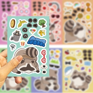 Close-up of DIY cartoon raccoon stickers with colorful accessories for creative craft work