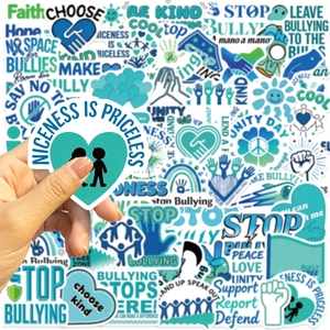 Close-up of waterproof anti-bullying stickers for laptops featuring kindness slogans