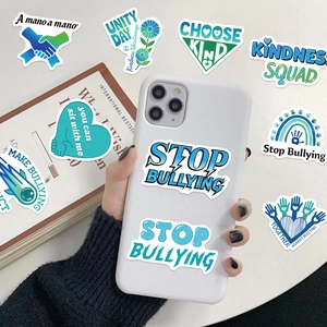 Detail showing anti-bullying waterproof stickers with positive slogans on a white phone case