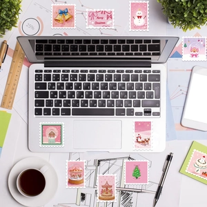 50 pieces of pink Christmas stamp stickers on a laptop with festive cartoon illustrations
