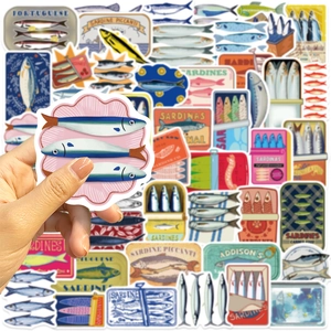 Close-up of vintage sardine can stickers showing real size for laptop decoration