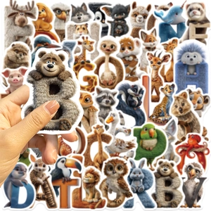 Close-up of hand holding a 3D animal alphabet sticker showing texture and size