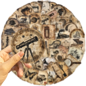 Macro detail of retro round stickers with vintage telescope design for journaling