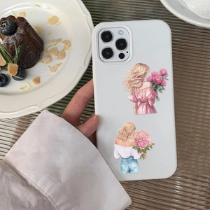 Floral illustration iPhone case held in a lifestyle tea time setting with desserts