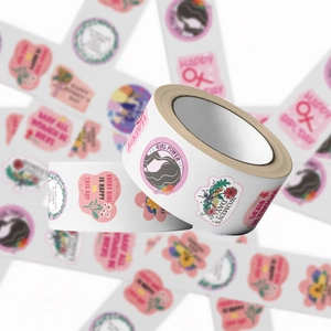 Macro view of Girl Power and Women's Day decorative stickers in pink roll format