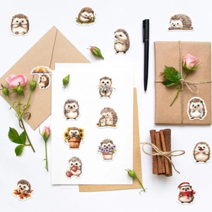 Hedgehog cartoon stickers on gift box with craft paper envelope and fresh roses