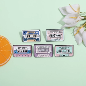 Set of 5 retro macaron cassette tape enamel pins with motivational text on green background