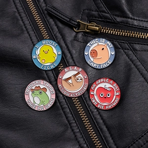 Set of 5 funny cartoon enamel pins with duck, sloth and frog on a black leather jacket