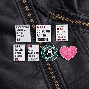 Set of 7 Taylor Swift themed enamel pins on black leather jacket with lyrics