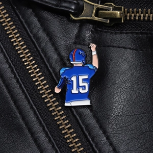 Macro detail of number 15 football player enamel pin on a black leather jacket