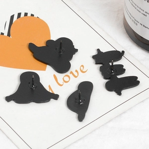 Detail view of the black matte alloy pin back and metal needle on sloth enamel brooches