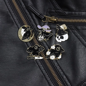 Gothic black crow enamel pins set displayed on a dark punk style leather jacket detail
