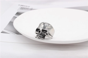 Macro detail of retro skull ring showing vintage finish and intricate gothic carving